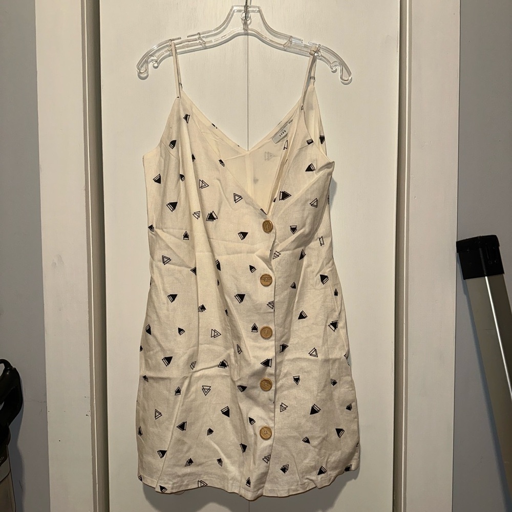 Lush Cream Top with Black Geometric Design